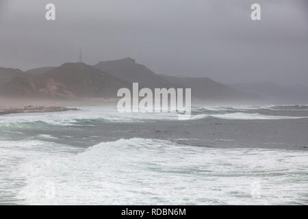 The rugged coastline of Mughsayl, near Salalah, Dhofar Province, Oman, during Khareef monsoon season Stock Photo