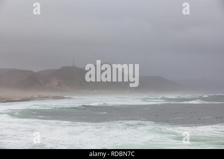 The rugged coastline of Mughsayl, near Salalah, Dhofar Province, Oman, during Khareef monsoon season Stock Photo