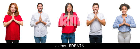 Collage of group chinese, indian, hispanic people over isolated background praying with hands together asking for forgiveness smiling confident. Stock Photo