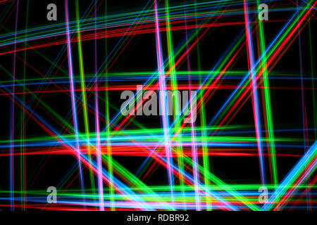 A colorful and glowing light painting abstract image with red, green, blue and yellow blurry lines over a black background, creating a net Stock Photo