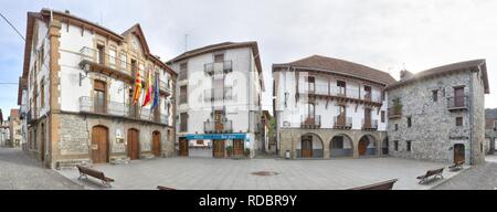 The Domingo Miral square with the town hall, with typical stone houses with dark roof in the rural Pyrenees mountain village of Ansó, in Aragon, Spain Stock Photo