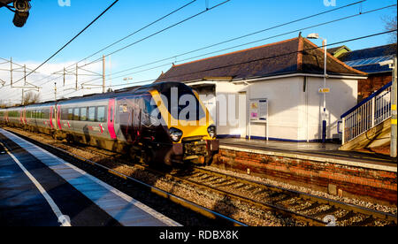 A Cross Country express train passing through Carluke station in South Lanarkshire, Scotland Stock Photo