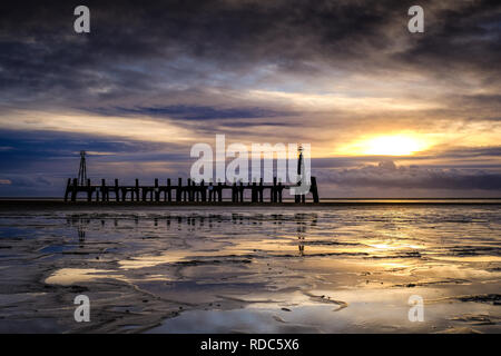 The remains of an old Landing Jetty on the beach at Lytham St Annes, nera Blackpool on the Fylde Coast. Stock Photo