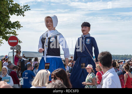 Giant figurines of Flipp and Zabeth dance through the crowds at the Fete de la Mer in Le Crotoy Stock Photo