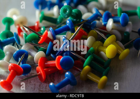 Colorful pushpins on a white board. School or business concept Stock Photo