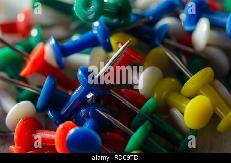 Colorful pushpins on a white board. School or business concept Stock Photo