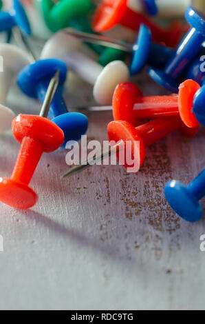 Colorful pushpins on a white board. School or business concept Stock Photo
