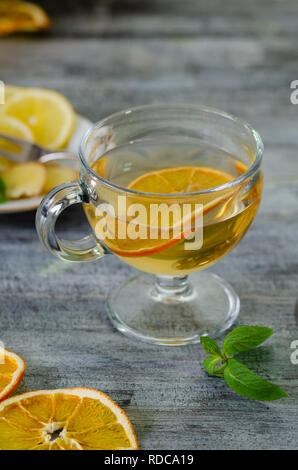 Herbal tea with lemon ,ginger, sage, linden and fresh mint leaves. Stock Photo