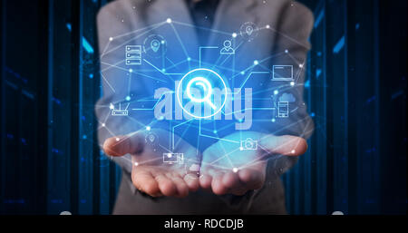Man holding hologram projection displaying cloud technology symbols  Stock Photo