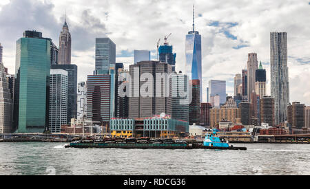 Cars pressed for recycling on tranport boat, New York, Manhattan, East River Stock Photo