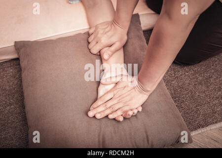 Top view of a female hand on the pillow Stock Photo