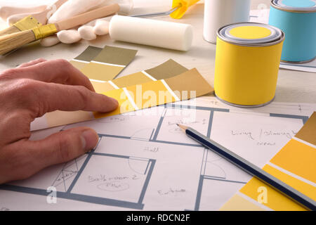 Decorator choosing yellow color for interior home painting project. Elevated view. Horizontal composition Stock Photo