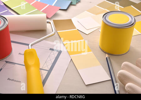 Tools and material on designer interior table with painting project. Elevated view. Horizontal composition Stock Photo