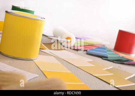 Tools and material on designer interior table with painting project. Front view. Horizontal composition Stock Photo