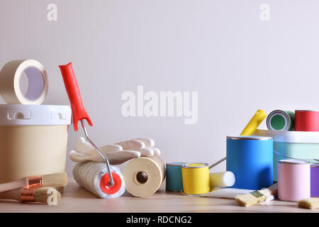 Painting tools for wall on table with white wall background Stock Photo
