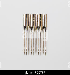 ten sewing needles close-up on a white background isolated Stock Photo