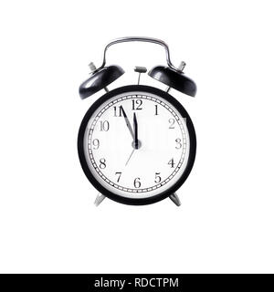 black alarm clock with white dial  against white background isolated Stock Photo