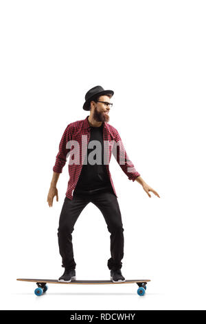 Full length shot of a young man riding a longboard isolated on white background Stock Photo