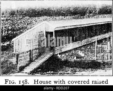 . Principles and practice of poultry culture . Poultry. Fit). I 57. Raised v.aik in front of house in Fig. t,C&gt;. (I'hotogvaph from Colorado Agricuiuira! ( olicgej. House with covered raised walk in front. Please note that these images are extracted from scanned page images that may have been digitally enhanced for readability - coloration and appearance of these illustrations may not perfectly resemble the original work.. Robinson, John H. (John Henry), 1863-1935. Boston ; New York : Ginn and Company Stock Photo