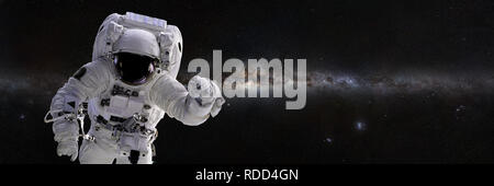 Astronaut, space walk in front of the Milky Way galaxy (3d illustration banner, elements of this image are furnished by NASA) Stock Photo