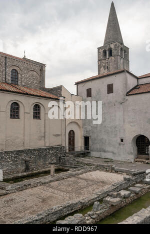 View of the bell tower and fourth century floor mosaics displayed at the Episcosal Complex of the Euphrasian Basilica, Porec, Croatia Stock Photo