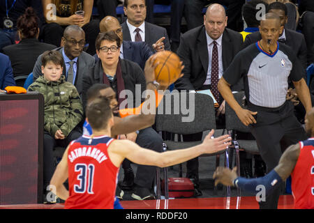 Londo , UK.  17 January 2019. Michael McIntyre (2nd left) and his son Ossie watch an NBA basketball game, NBA London 2019, between Washington Wizards and New York Knicks at the O2 Arena.  Final score: Wizards 101 Knicks 100.  Credit: Stephen Chung / Alamy Live News Stock Photo