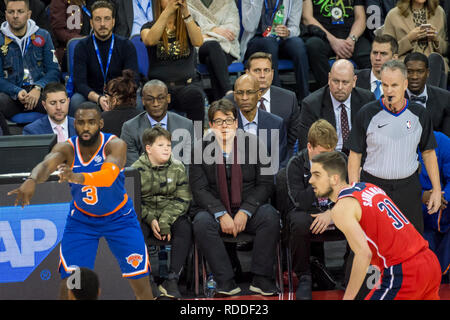 Londo , UK.  17 January 2019. Michael McIntyre (C) and his son Ossie watch an NBA basketball game, NBA London 2019, between Washington Wizards and New York Knicks at the O2 Arena.  Final score: Wizards 101 Knicks 100.  Credit: Stephen Chung / Alamy Live News Stock Photo