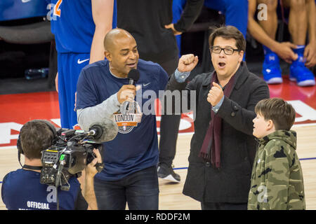 Londo , UK.  17 January 2019. Michael McIntyre (2R) and his son Ossie are interviewed during an NBA basketball game, NBA London 2019, between Washington Wizards and New York Knicks at the O2 Arena.  Final score: Wizards 101 Knicks 100.  Credit: Stephen Chung / Alamy Live News Stock Photo