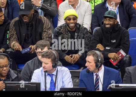 Londo , UK.  17 January 2019. Tinie Tempah (C), singer, watches an NBA basketball game, NBA London 2019, between Washington Wizards and New York Knicks at the O2 Arena.  Final score: Wizards 101 Knicks 100.  Credit: Stephen Chung / Alamy Live NewsTinie Tempah Stock Photo