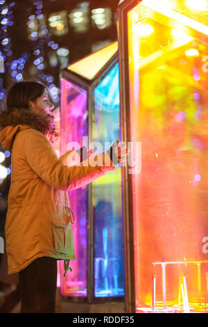 Canary Wharf, London, UK, 17th Jan 2019. Visitors interact and pose with the Prismatica installation of colourful columns in Jubilee Plaza. Many have seized the the cold but dry evening to visit Winter Lights, with crowds and queues building at some installations. Canary Wharf Winter Lights has returned for its fifth year with spectacular light installations and free to view interactive art.  It runs  until Jan 26th. Credit: Imageplotter News and Sports/Alamy Live News Stock Photo