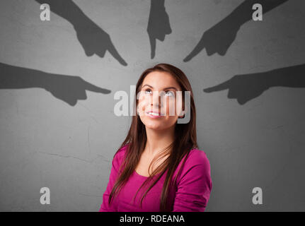Young innocent  student with pointing hands concept  Stock Photo