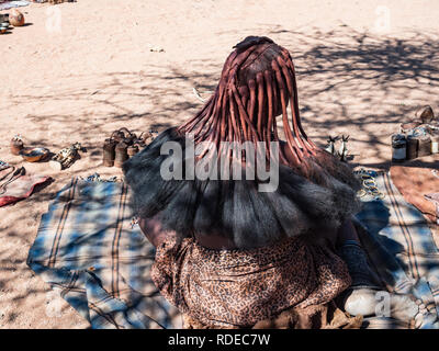 NAMIBIA, KAMANJAB, DECEMBER 4, 2018, Himba tribe woman in the village of Himba people, women himba hairstyle, The himbas are a minority and traditiona Stock Photo