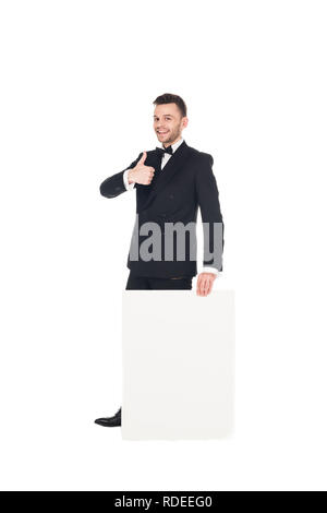 handsome elegant man with blank placard showing thumb up isolated on white Stock Photo