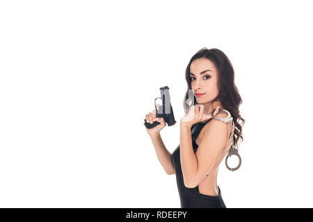 beautiful security agent in black dress holding gun and handcuffs, isolated on white Stock Photo