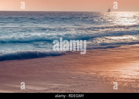 Abstract seascape in blue and light pink colors with the lonely boat on the horizon. Stock Photo
