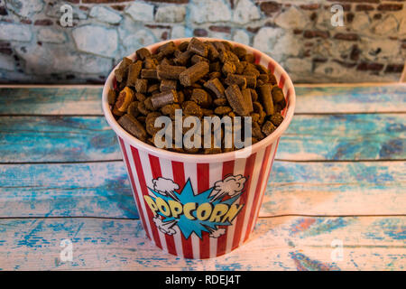 dog prizes in a container of popcorn Stock Photo