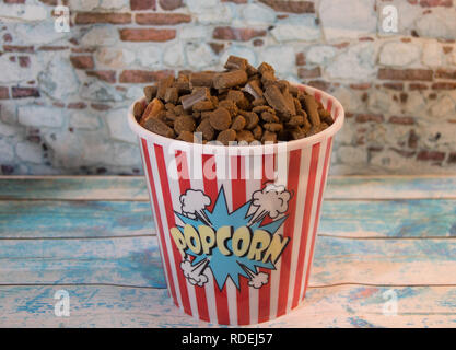 dog prizes in a container of popcorn Stock Photo