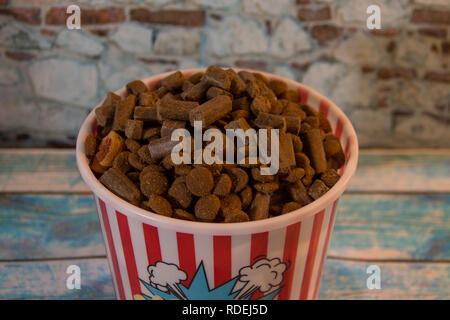 dog prizes in a container of popcorn Stock Photo