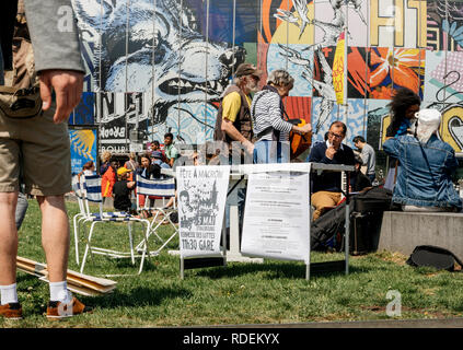 STRASBOURG, FRANCE - MAY 5, 2018: People making a party protest Fete a Macron in front of Gare de Strasbourg - advertising placards Stock Photo