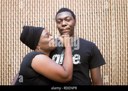 Black mom and teenager son having conversation about love and life Stock Photo