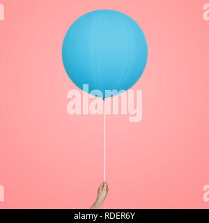 blue happy holiday air flying balloon in man hand Stock Photo
