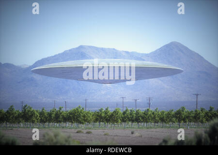 Unidentified flying object - UFO, flying over plantations in desert place with mountains behind. Stock Photo