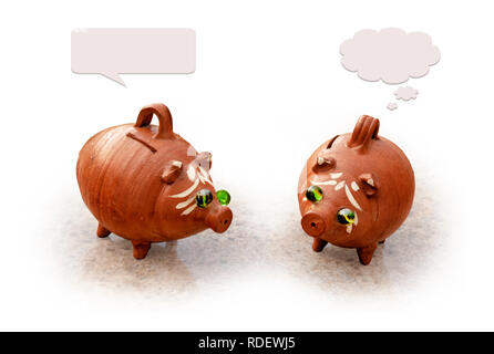 two ceramic piggy banks discussing finance on white background Stock Photo