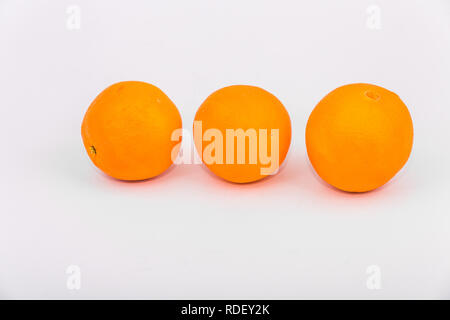 Three Whole Oranges on White Stock Photo