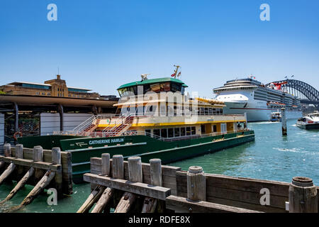 Sydney ferry Catherine Hamlin and a cruise ship at Sydney Circular Quay in summer,Sydney,Australia Stock Photo
