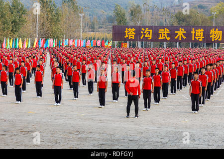 DENGFENG, CHINA - October 17, 2018: Children kung fu fighting school at the Shaolin Monastery Shaolin Temple, Zen Buddhist temple. UNESCO World Herita Stock Photo