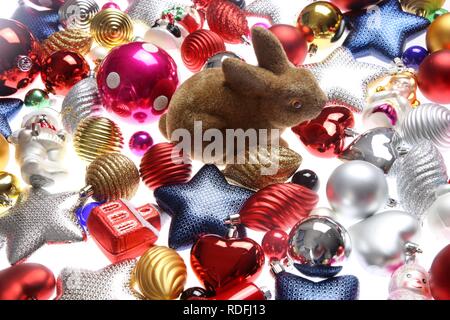 Christmas decorations, various Christmas tree balls and a Easter bunny Stock Photo