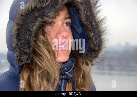 Belgrade, Serbia, January 2019 - Portrait of a woman wearing fur hooded jacket Stock Photo