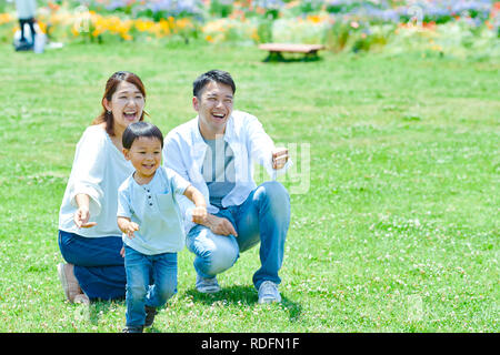 Japanese family in a city park Stock Photo