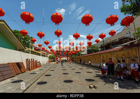 Manado, Indonesia - August 04 2015: Peoples on Klenteng Kwan Kong Temple courtyard, one of the oldest temple in Manado which was founded in 1819. Stock Photo